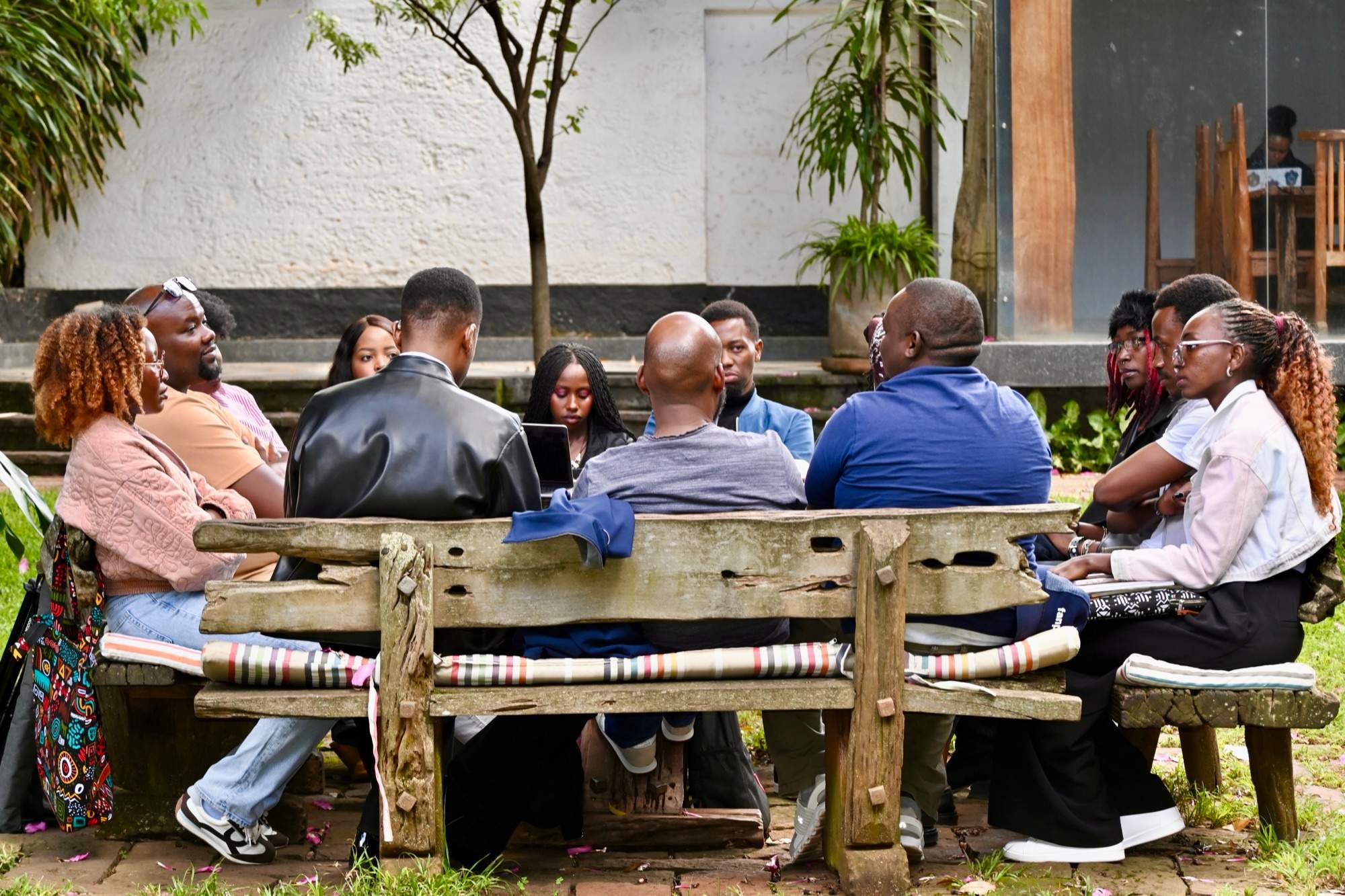 The MOOKH team on a bench outdoors